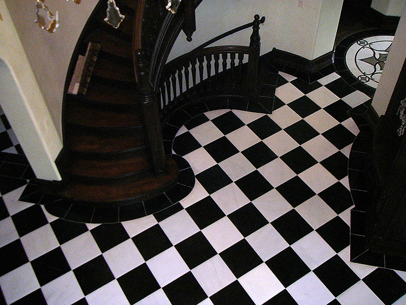 Magnificent grand foyer with checker board pattern stone tiles on the floor