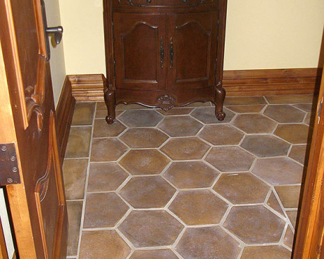Powder room with concrete tiles on the floor