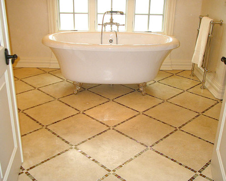 Very elegant master bathroom with freestanding tub and nice floor pattern