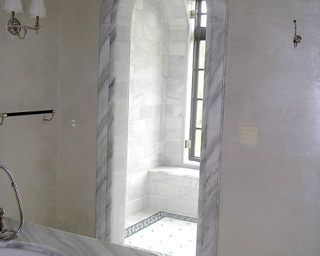 White marble with black mozaik in master bathroom